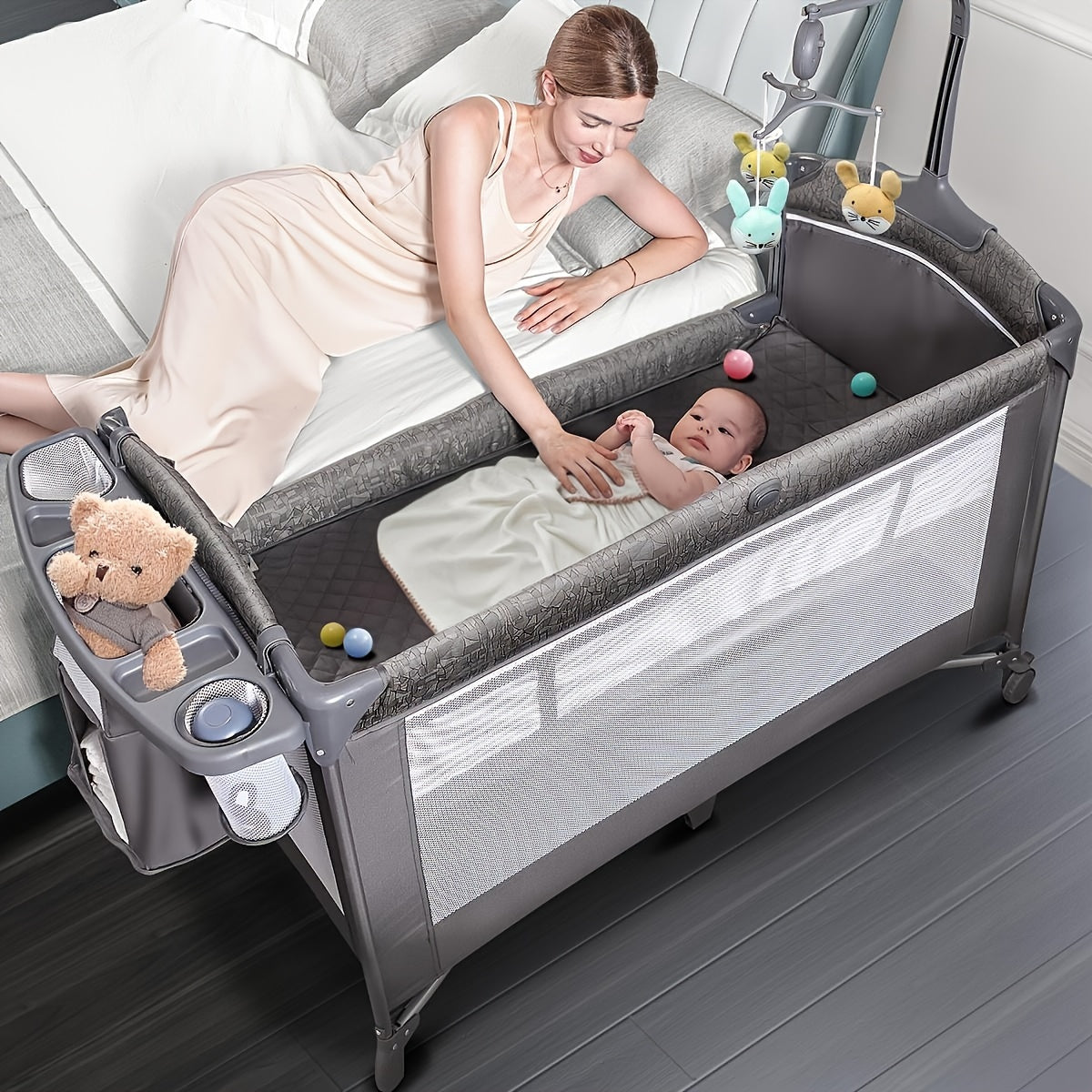 4 In 1 Wide Bassinet, Pack And Play With Sheet, Diaper Changing Table And Music Mobile With Storage