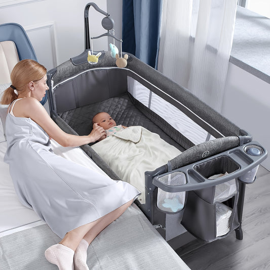 4 In 1 Wide Bassinet, Pack And Play With Sheet, Diaper Changing Table And Music Mobile With Storage